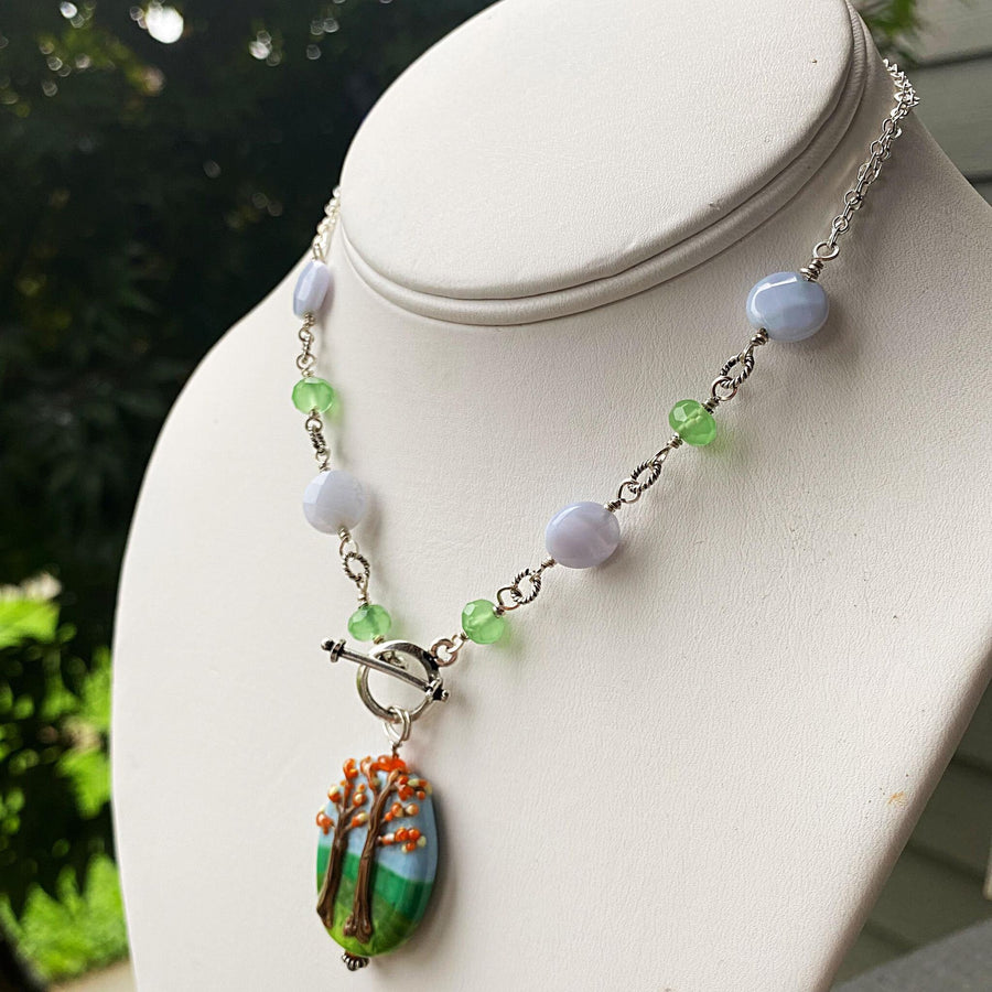 Stunning Artisan Sterling Silver and Fall Trees Scene Lampwork Glass necklace with Blue Lace Agate and Green Quartz Accents, Front Toggle