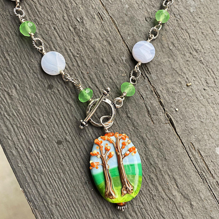 Stunning Artisan Sterling Silver and Fall Trees Scene Lampwork Glass necklace with Blue Lace Agate and Green Quartz Accents, Front Toggle