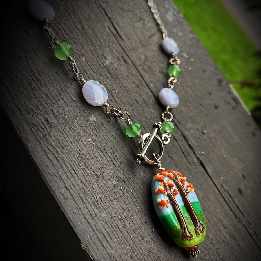 Stunning Artisan Sterling Silver and Fall Trees Scene Lampwork Glass necklace with Blue Lace Agate and Green Quartz Accents, Front Toggle