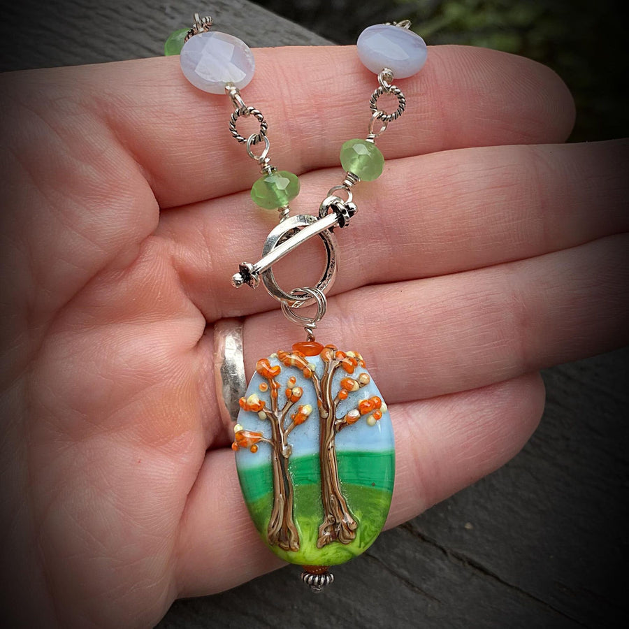 Stunning Artisan Sterling Silver and Fall Trees Scene Lampwork Glass necklace with Blue Lace Agate and Green Quartz Accents, Front Toggle