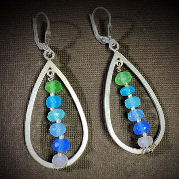 Artisan Sterling Silver teardrops with a single line of cascading blue colored quartz stones. Very unique, one of a kind. Leverback earwires