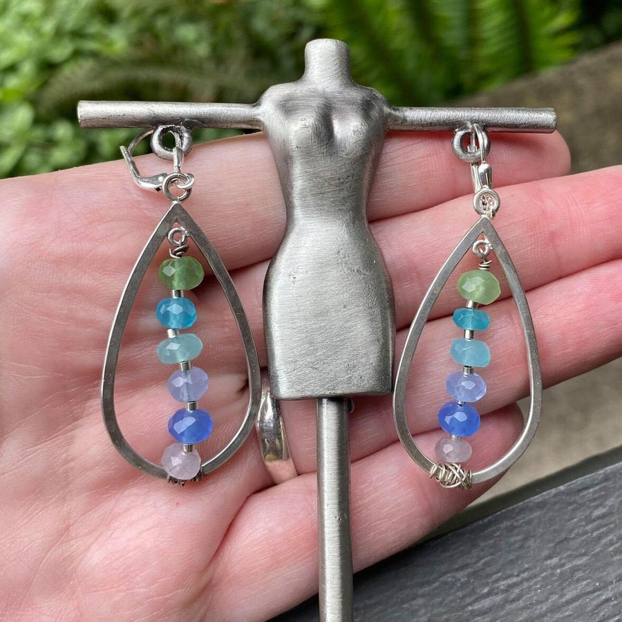 Artisan Sterling Silver teardrops with a single line of cascading blue colored quartz stones. Very unique, one of a kind. Leverback earwires