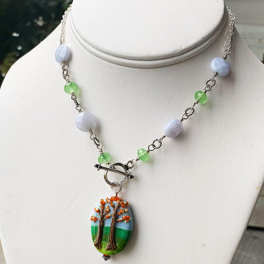 Stunning Artisan Sterling Silver and Fall Trees Scene Lampwork Glass necklace with Blue Lace Agate and Green Quartz Accents, Front Toggle