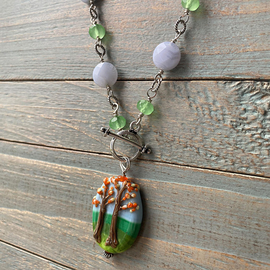 Stunning Artisan Sterling Silver and Fall Trees Scene Lampwork Glass necklace with Blue Lace Agate and Green Quartz Accents, Front Toggle