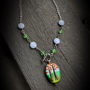 Stunning Artisan Sterling Silver and Fall Trees Scene Lampwork Glass necklace with Blue Lace Agate and Green Quartz Accents, Front Toggle