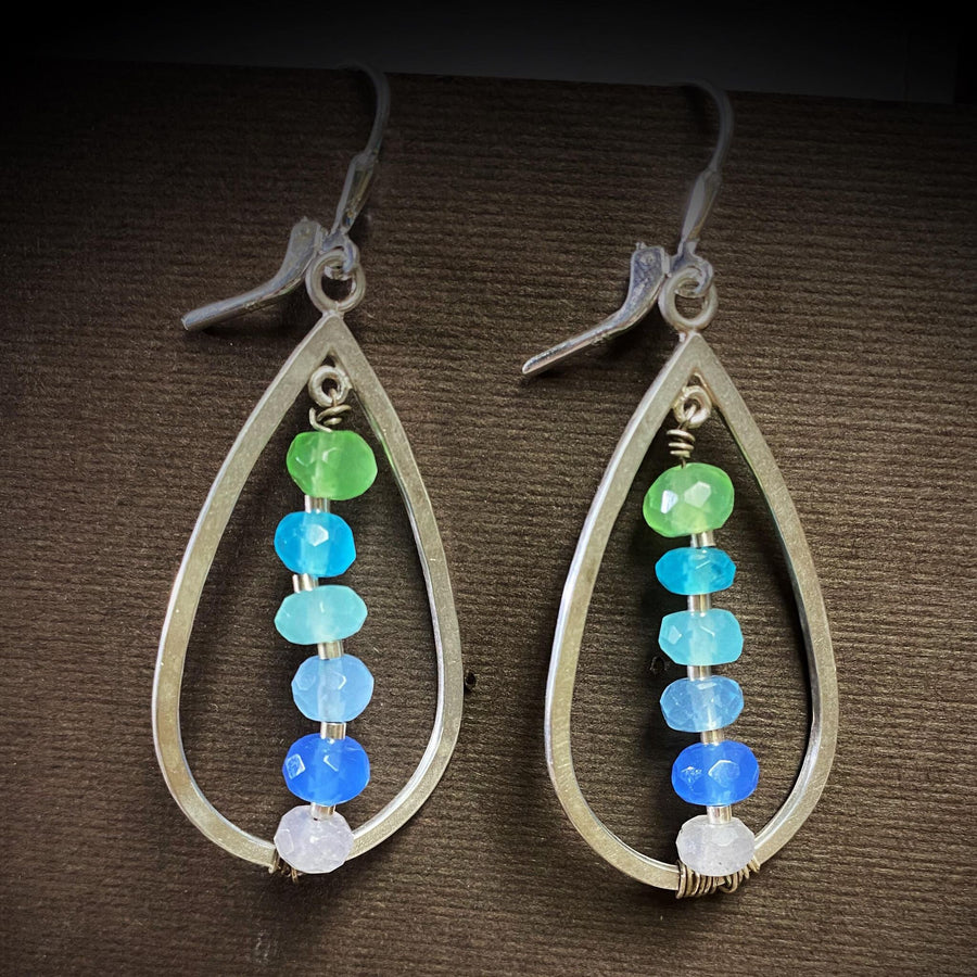 Artisan Sterling Silver teardrops with a single line of cascading blue colored quartz stones. Very unique, one of a kind. Leverback earwires