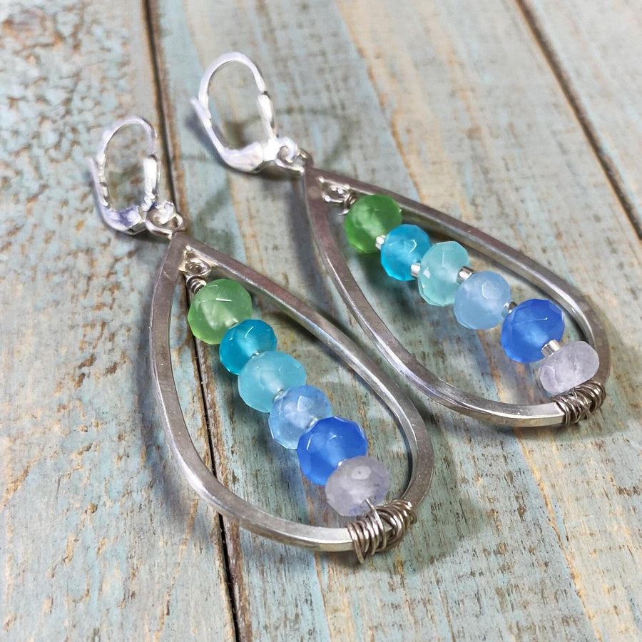 Artisan Sterling Silver teardrops with a single line of cascading blue colored quartz stones. Very unique, one of a kind. Leverback earwires