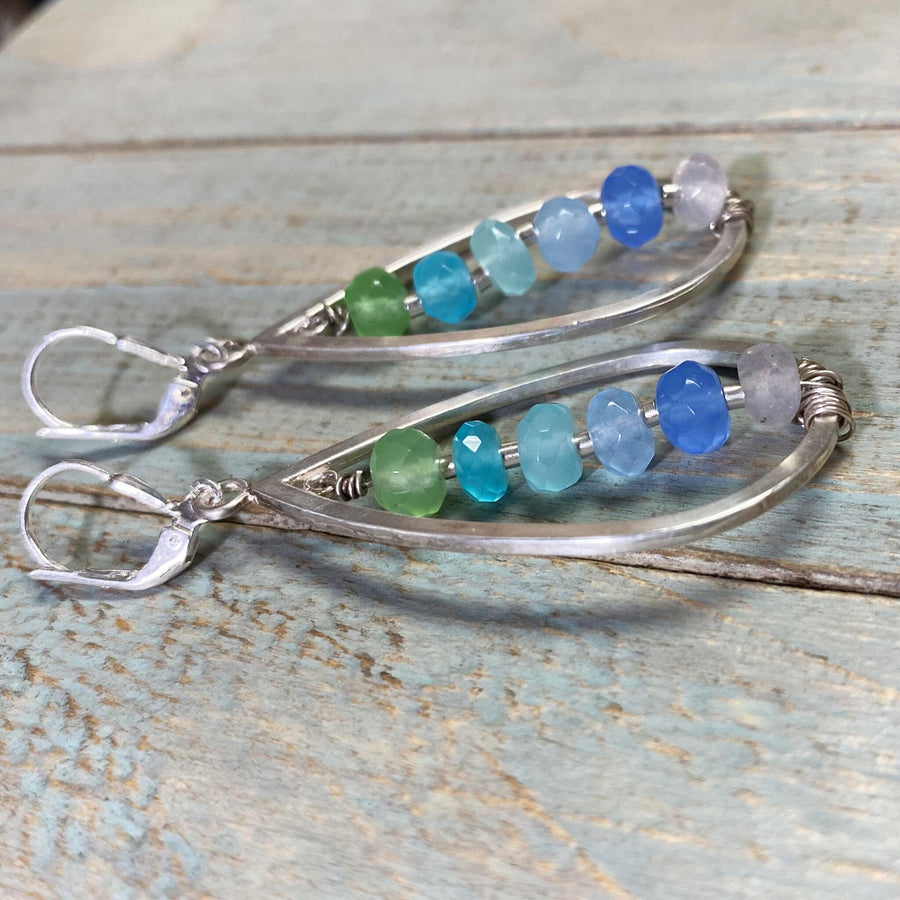 Artisan Sterling Silver teardrops with a single line of cascading blue colored quartz stones. Very unique, one of a kind. Leverback earwires